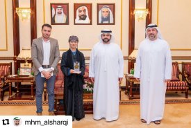 Mohammed Al Sharqi meets with student Mona Wang Yue, affiliated with the Fujairah Academy of Fine Arts, who won second place in the seventh annual art exhibition at Al Qasimia University, entitled �Artistic Radiances,� in the Arabic Calligraphy category.