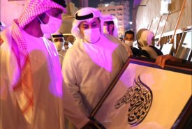 His Excellency Ali Obaid Al-Hafiti presents as a gift to His Highness Sheikh Ammar bin Humaid Al Nuaimi, Crown Prince of Ajman, a painting in Diwani calligraphy made by Professor Muhammad Abu Al Majd through the academy�s participation in the Al Murabbaa 